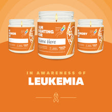 Load image into Gallery viewer, Leukemia Awareness soy candle in a 9 oz glass jar, in collaboration with GRACE, from Angela Rose Studios. Choose from three messages: "I Am Fighting For," "In Honor Of," or "In Memory Of," and personalize it with the name of your loved one. Each candle supports cancer patients, with 100% of proceeds donated to Greater Richland Area Cancer Elimination, Inc.