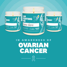 Load image into Gallery viewer, Ovarian Cancer Awareness soy candle in a 9 oz glass jar, in collaboration with GRACE, from Angela Rose Studios. Choose from three messages: "I Am Fighting For," "In Honor Of," or "In Memory Of," and personalize it with the name of your loved one. Each candle supports cancer patients, with 100% of proceeds donated to Greater Richland Area Cancer Elimination, Inc.