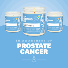 Load image into Gallery viewer, Prostate Cancer Awareness soy candle in a 9 oz glass jar, in collaboration with GRACE, from Angela Rose Studios. Choose from three messages: "I Am Fighting For," "In Honor Of," or "In Memory Of," and personalize it with the name of your loved one. Each candle supports cancer patients, with 100% of proceeds donated to Greater Richland Area Cancer Elimination, Inc.