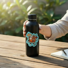 Load image into Gallery viewer, Person holding a black water bottle with a brandy old fashioned cartoon character sticker.