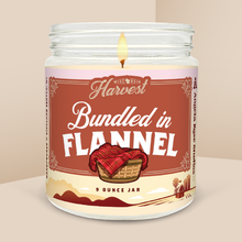 Load image into Gallery viewer, Bundled in Flannel soy candle in a 9 oz glass jar, from the Wisconsin Harvest Collection by Angela Rose Studios.