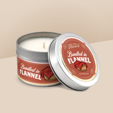 Load image into Gallery viewer, Bundled in Flannel soy candle in a 4 oz travel tin, from the Wisconsin Harvest Collection by Angela Rose Studios.
