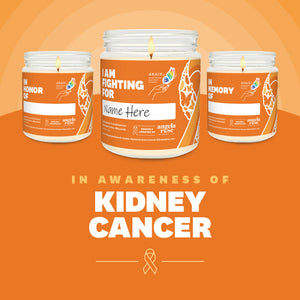 Kidney Cancer Awareness soy candle in a 9 oz glass jar, in collaboration with GRACE, from Angela Rose Studios. Choose from three messages: "I Am Fighting For," "In Honor Of," or "In Memory Of," and personalize it with the name of your loved one. Each candle supports cancer patients, with 100% of proceeds donated to Greater Richland Area Cancer Elimination, Inc.