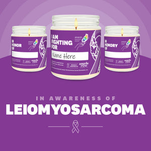 Leiomyosarcoma Awareness soy candle in a 9 oz glass jar, in collaboration with GRACE, from Angela Rose Studios. Choose from three messages: "I Am Fighting For," "In Honor Of," or "In Memory Of," and personalize it with the name of your loved one. Each candle supports cancer patients, with 100% of proceeds donated to Greater Richland Area Cancer Elimination, Inc.