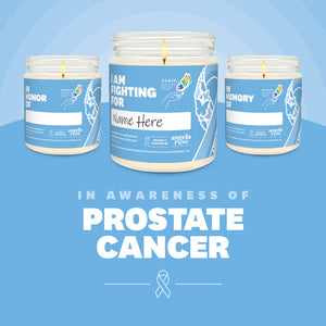 Prostate Cancer Awareness soy candle in a 9 oz glass jar, in collaboration with GRACE, from Angela Rose Studios. Choose from three messages: "I Am Fighting For," "In Honor Of," or "In Memory Of," and personalize it with the name of your loved one. Each candle supports cancer patients, with 100% of proceeds donated to Greater Richland Area Cancer Elimination, Inc.