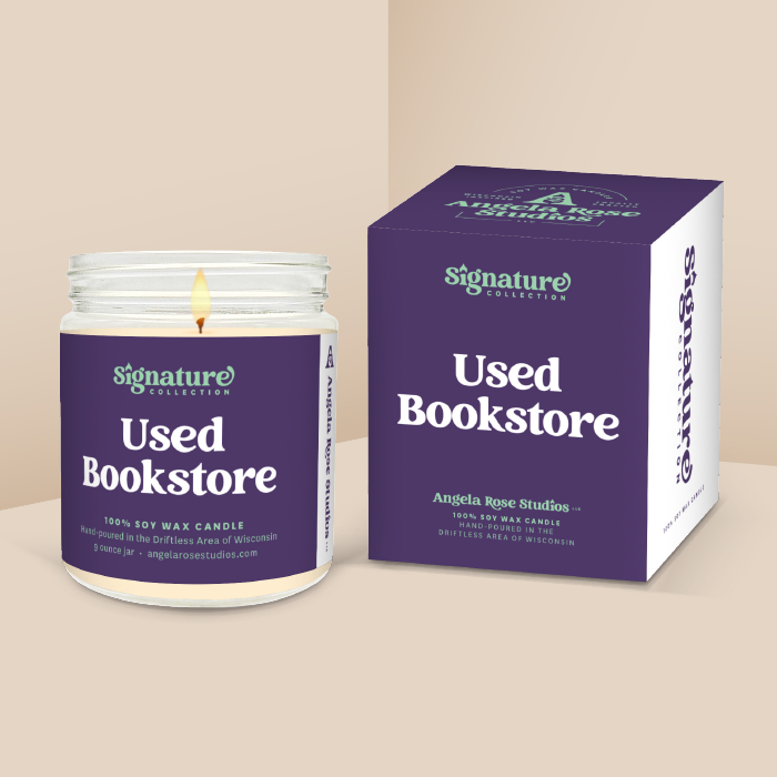 Used Bookstore soy candle in a 9 oz glass jar with packaging box, from the Signature Collection by Angela Rose Studios.